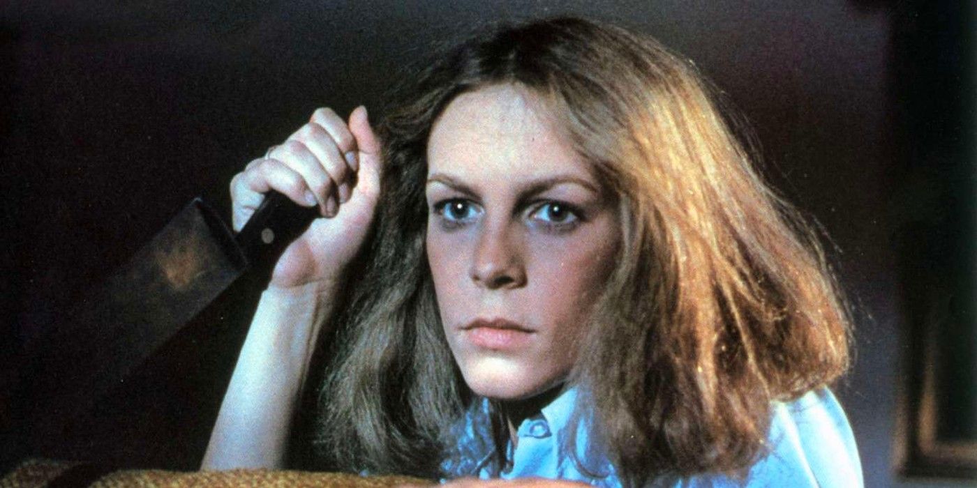 Jamie Lee Curtis as Laurie Strode holding a knife in Halloween (1978)