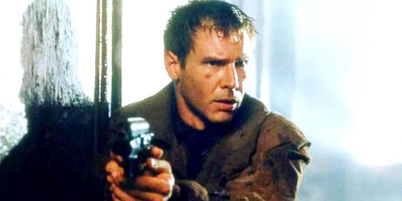 Harrison Ford as Rick Deckard with a gun in Blade Runner.