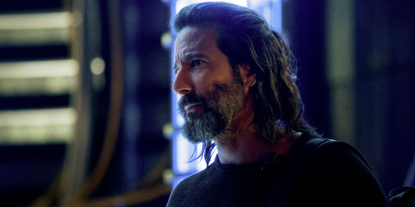 Henry Ian Cusick as Kane looking serious with long hair and a beard in The 100