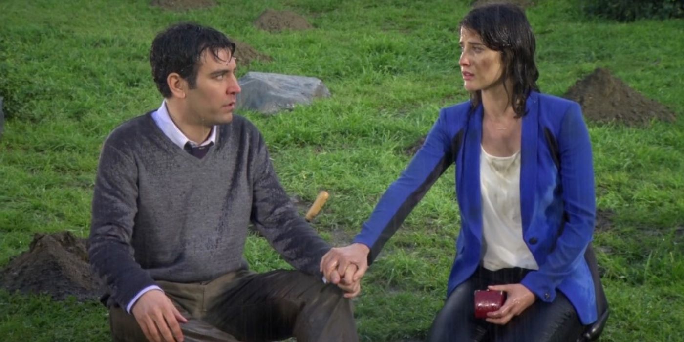 Josh Radnor and Cobie Smulders as Ted Mosby and Robin holding hands in the grass in How I Met Your Mother