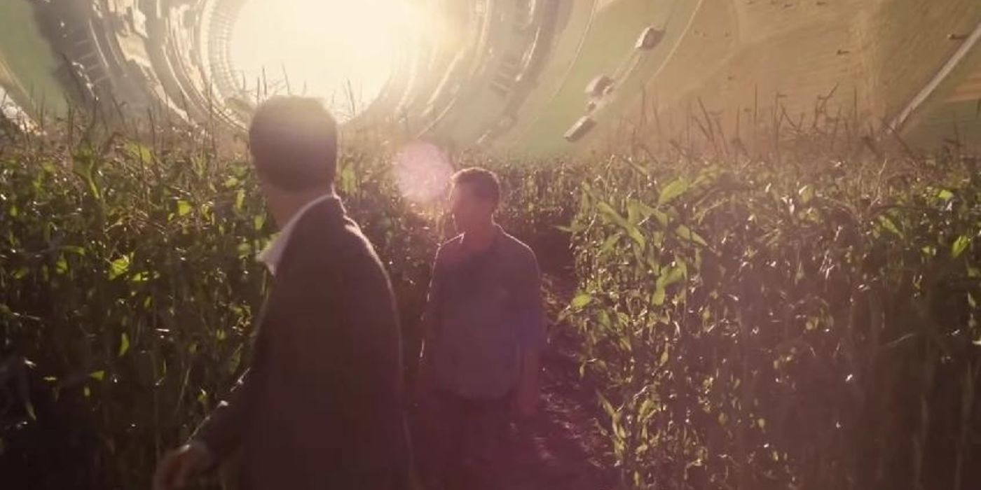 Humans walking through a field inside Cooper's Station in Interstellar