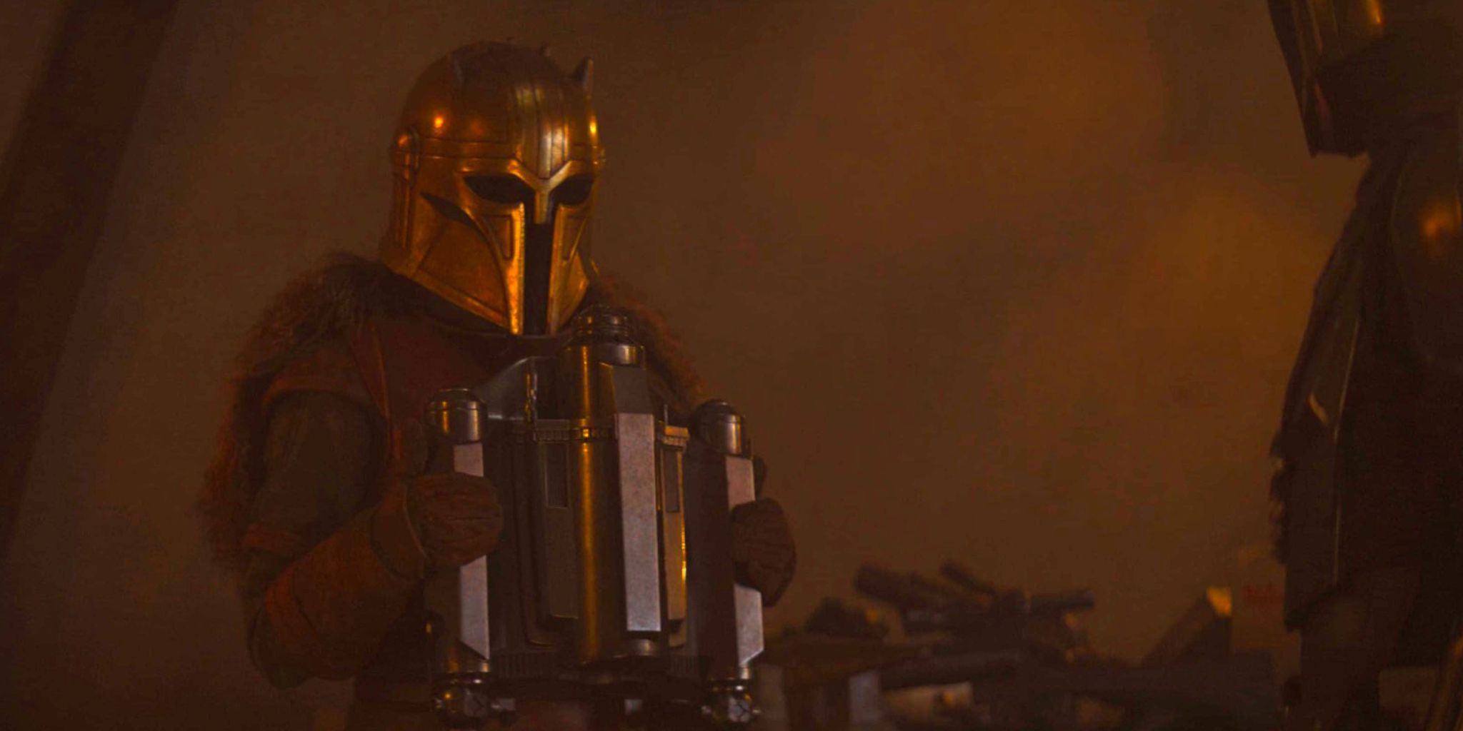The Armorer gives Din Djarin his jetpack in The Mandalorian