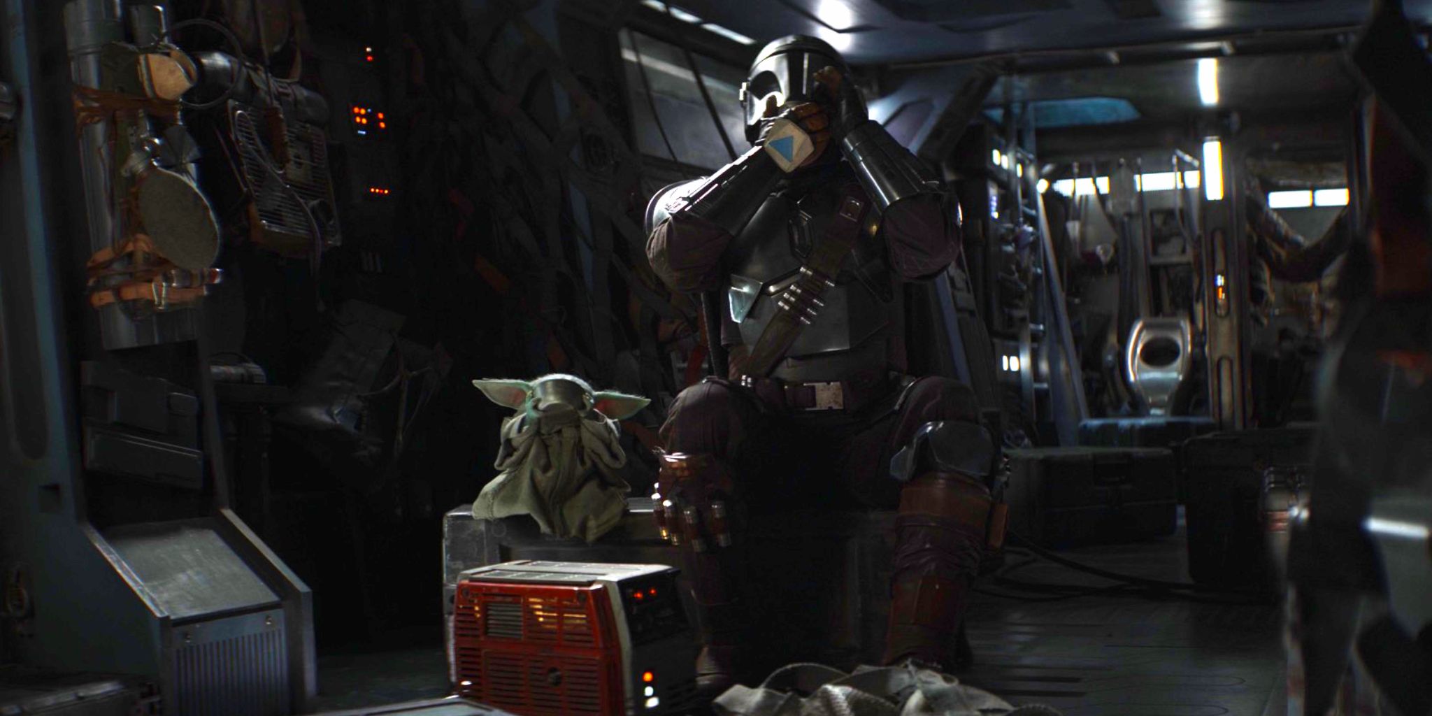 Din Djarin and Grogu sipping soup together in the Razor Crest in The Mandalorian season 2 episode 4.