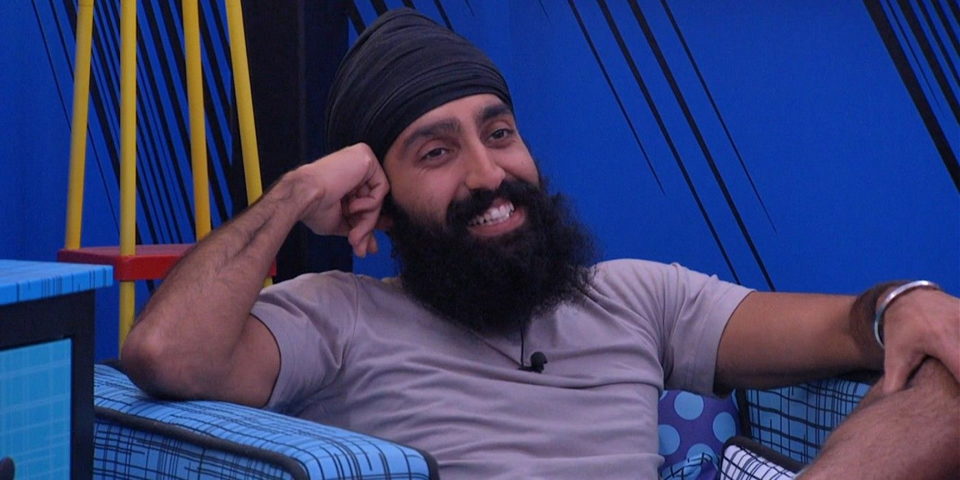 Big Brother 25's Jag Bains, smiling and resting his head against his hand