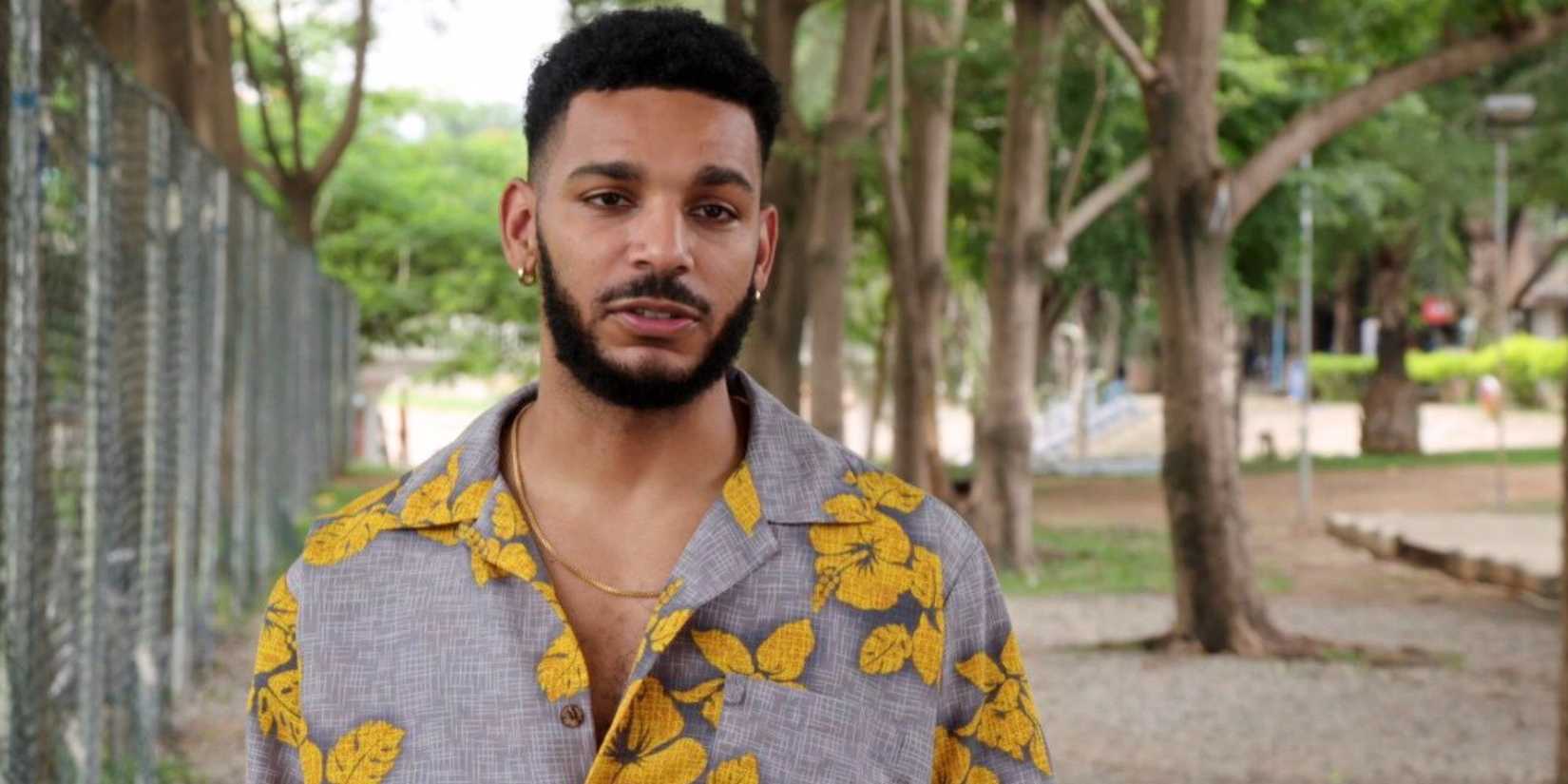 Jamal Menzies from 90 Day Fiance franchise in grey shirt with yellow flowers