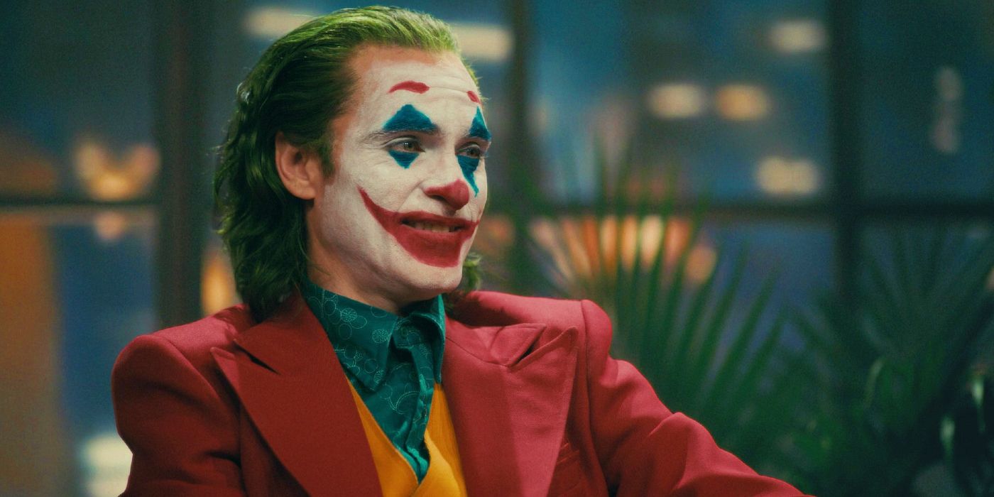 Joaquin Phoenix in Joker makeup speaks at a talk show in Joker