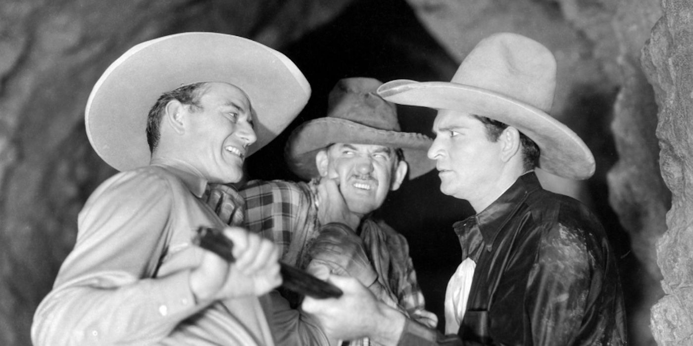 John Wayne wrestles a gun from his attackers in Sagebrush Trail
