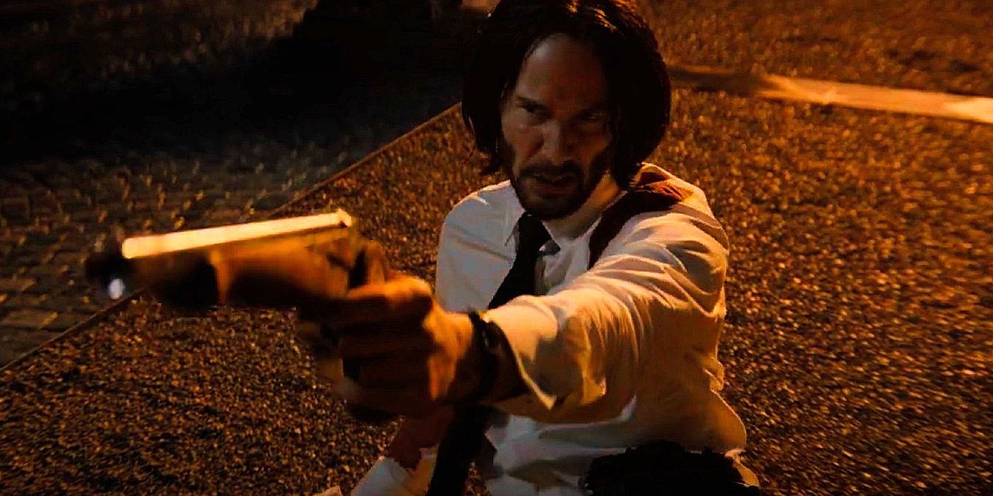 John Wick pointing a gun during the Marquis duel in John Wick 4