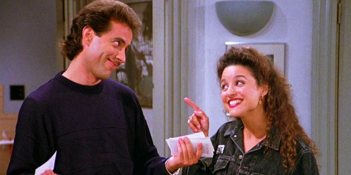 Julia Louis-Dreyfus sorrindo e apontando para Jerry Seinfeld em Seinfeld.