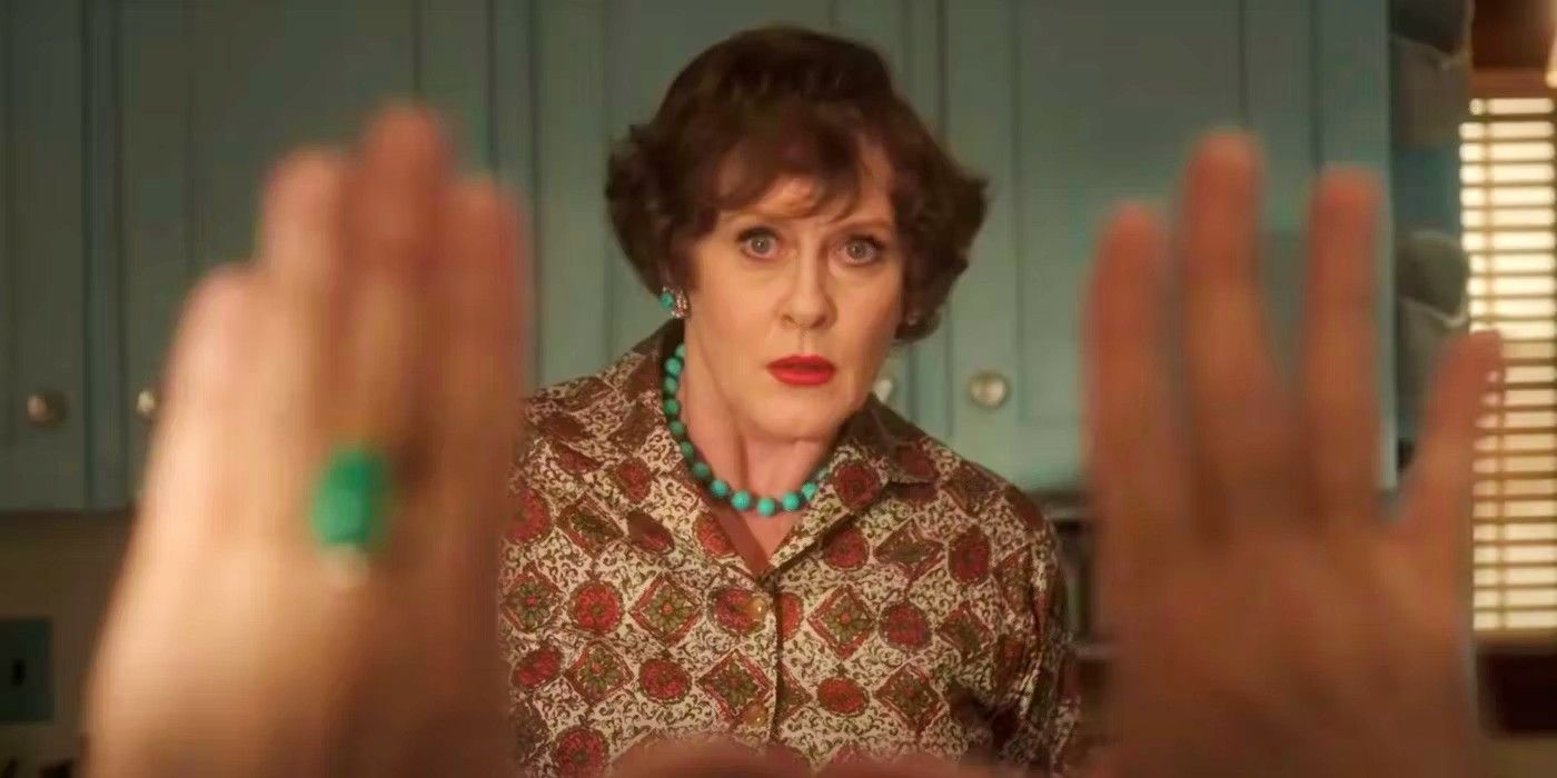 Sarah Lancashire as Julia Child with someone framing her with their hands in Julia season 2