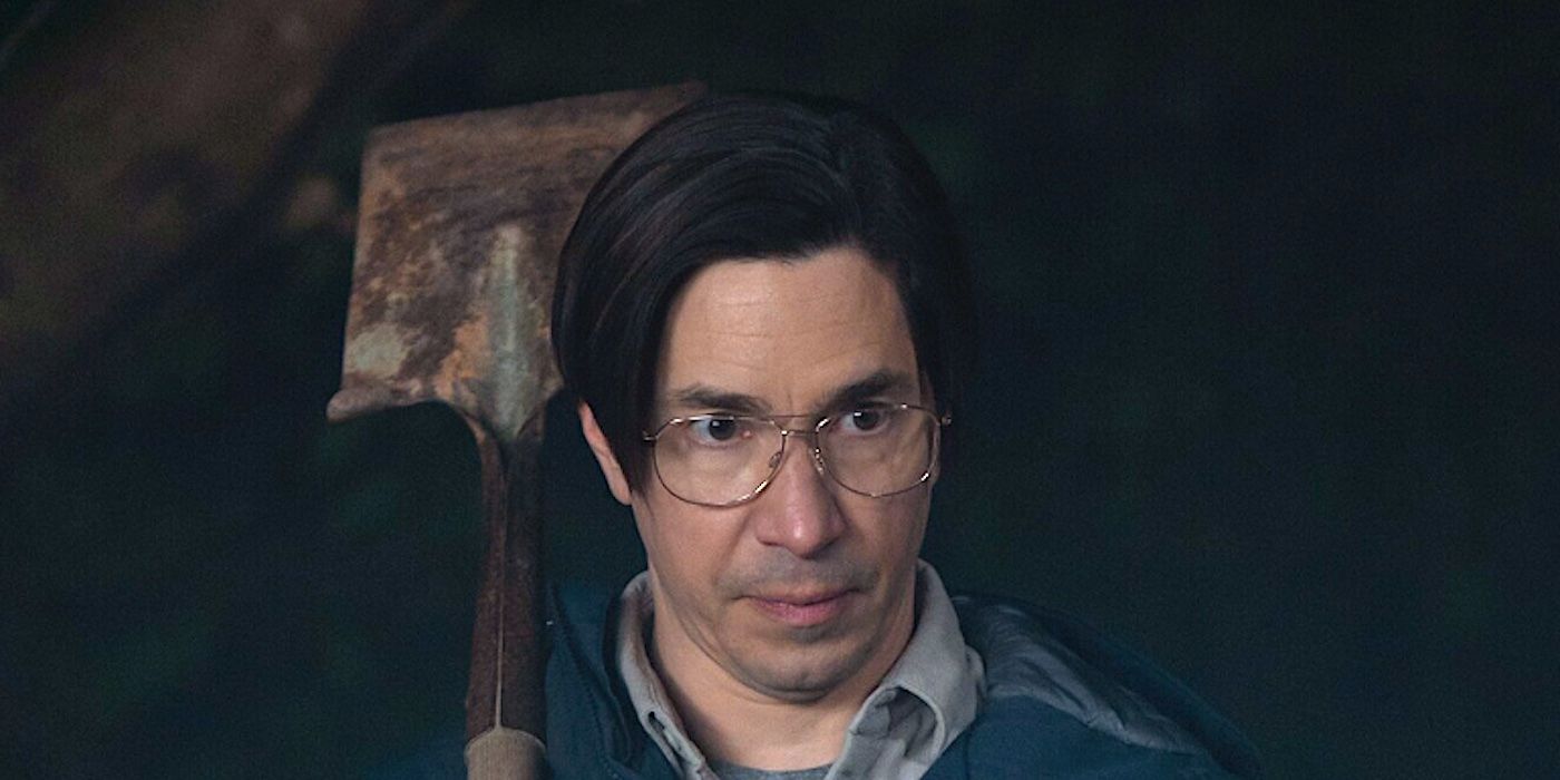 Justin Long's Mr. Bratt staring ominously while holding a shovel in Goosebumps 2023