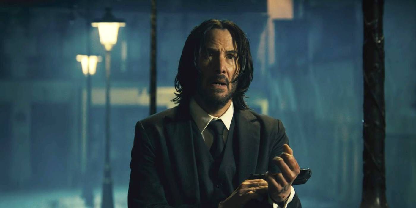 Keanu Reeves holding a gun in John Wick: Chapter 4.