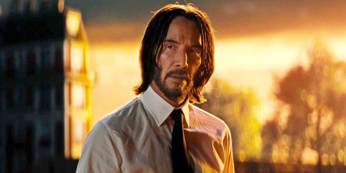 Keanu Reeves as John Wick with the sun rising behind him in John Wick: Chapter 4.