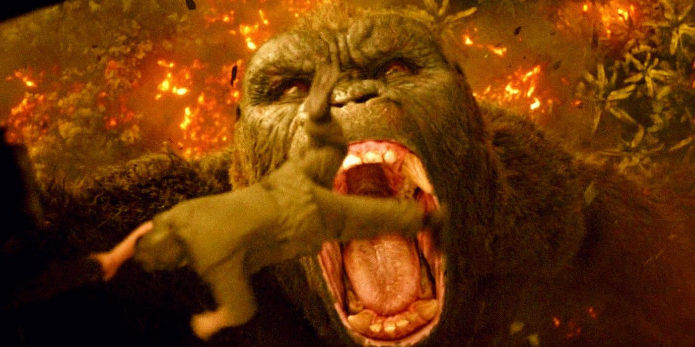 King Kong with his mouth wide about to eat a man falling from a helicopter in Skull Island