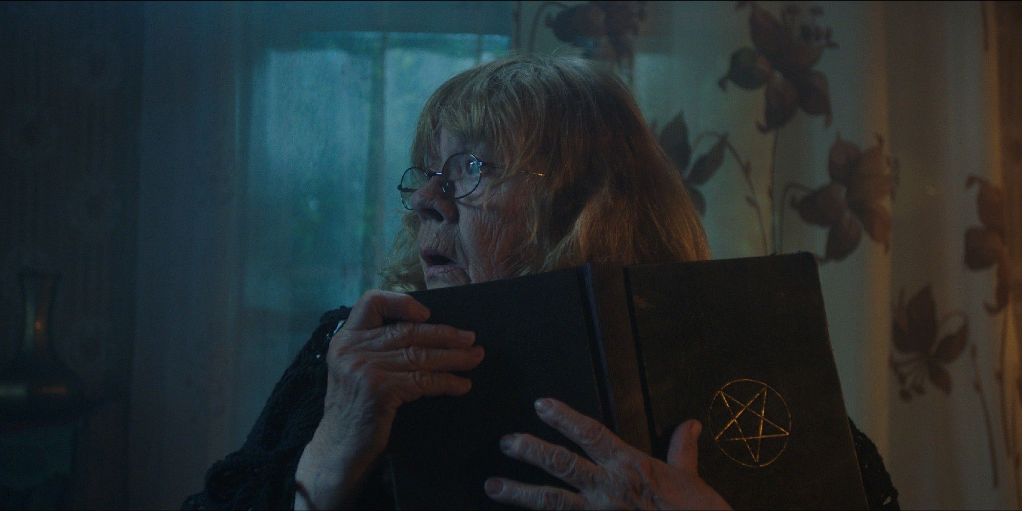kratt mari lill as grandma reading satanic book