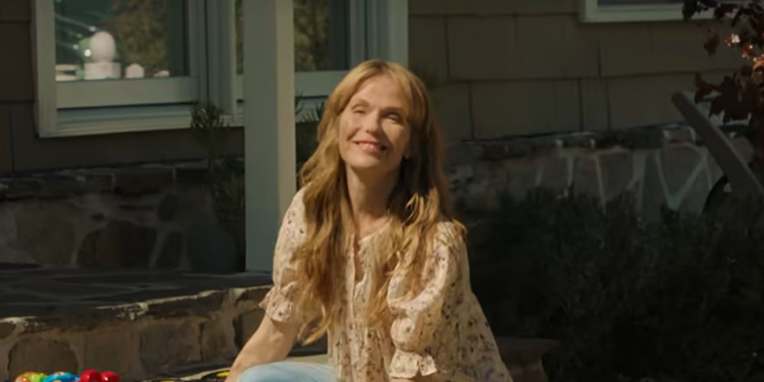 Leah Kelly sits over on her front steps.