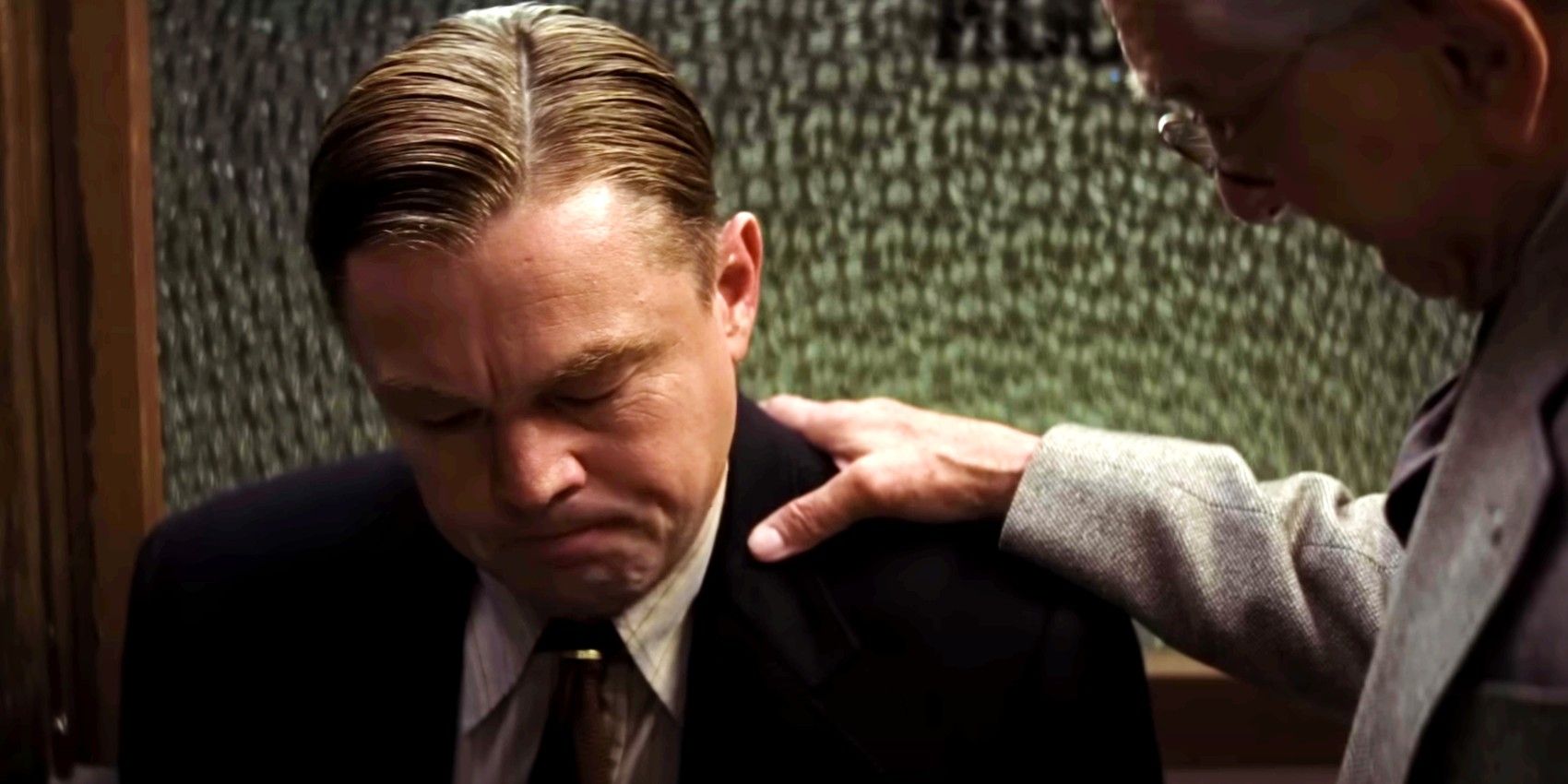 Leo DiCaprio with his head bent in shame in Killers of the Flower Moon