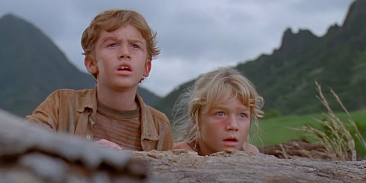 Lex and Tim look off-screen in amazement in Jurassic Park