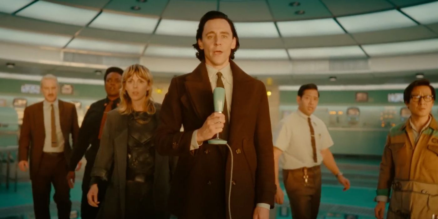 Loki talks into a microphone