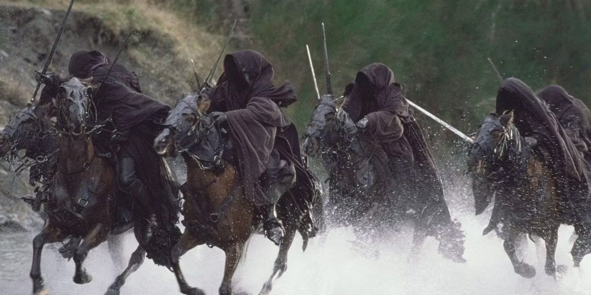 Nazgul on horses with swords drawn crossing a river in The Lord of the Rings: The Fellowship of the RIng.