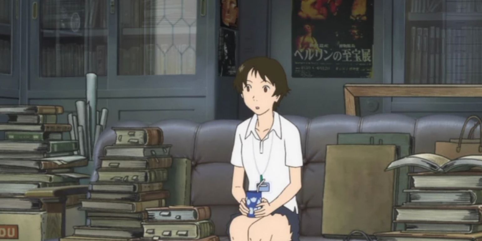 Makoto Konno sitting among piles of books in The Girl Who Leapt Through Time