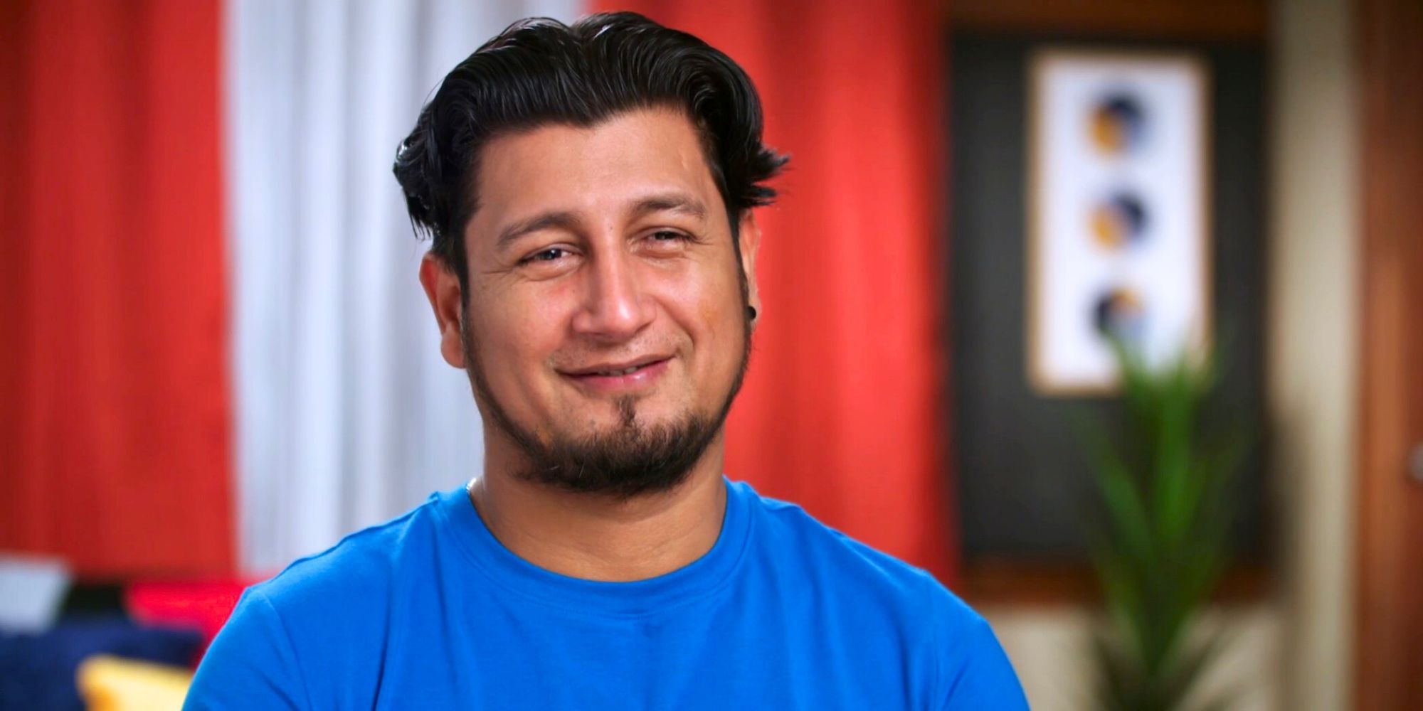 Manuel 90 Day Fiance season 10 in blue shirt for interview