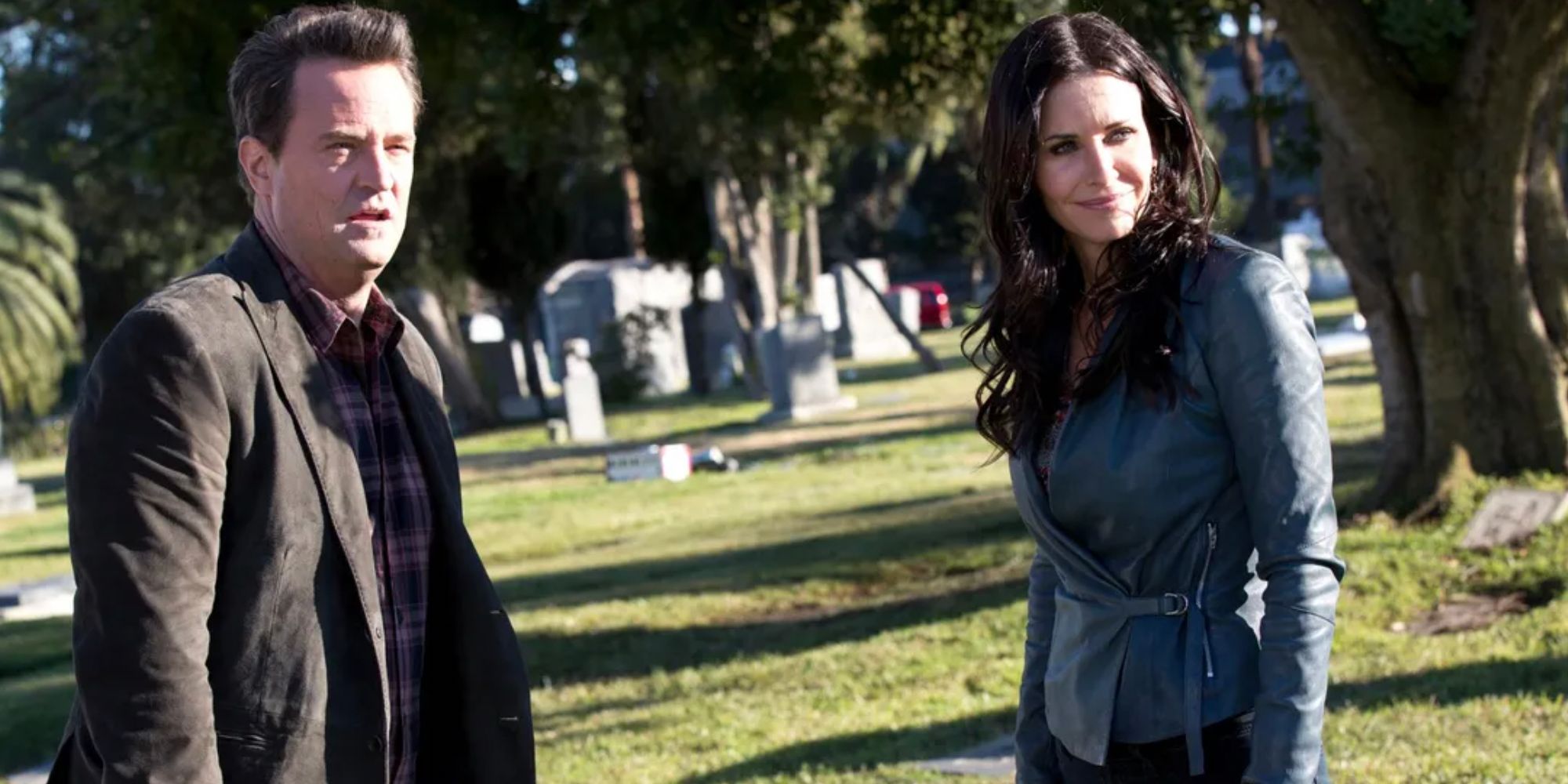 Matthew Perry and Courtney Cox in a cemetary in Go On