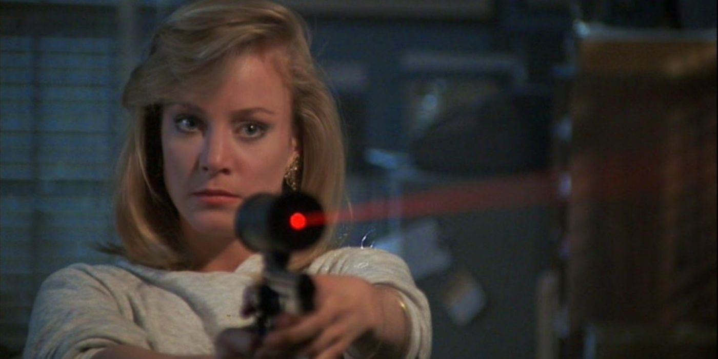 Megan Garris aims a gun at Jason Voorhees.