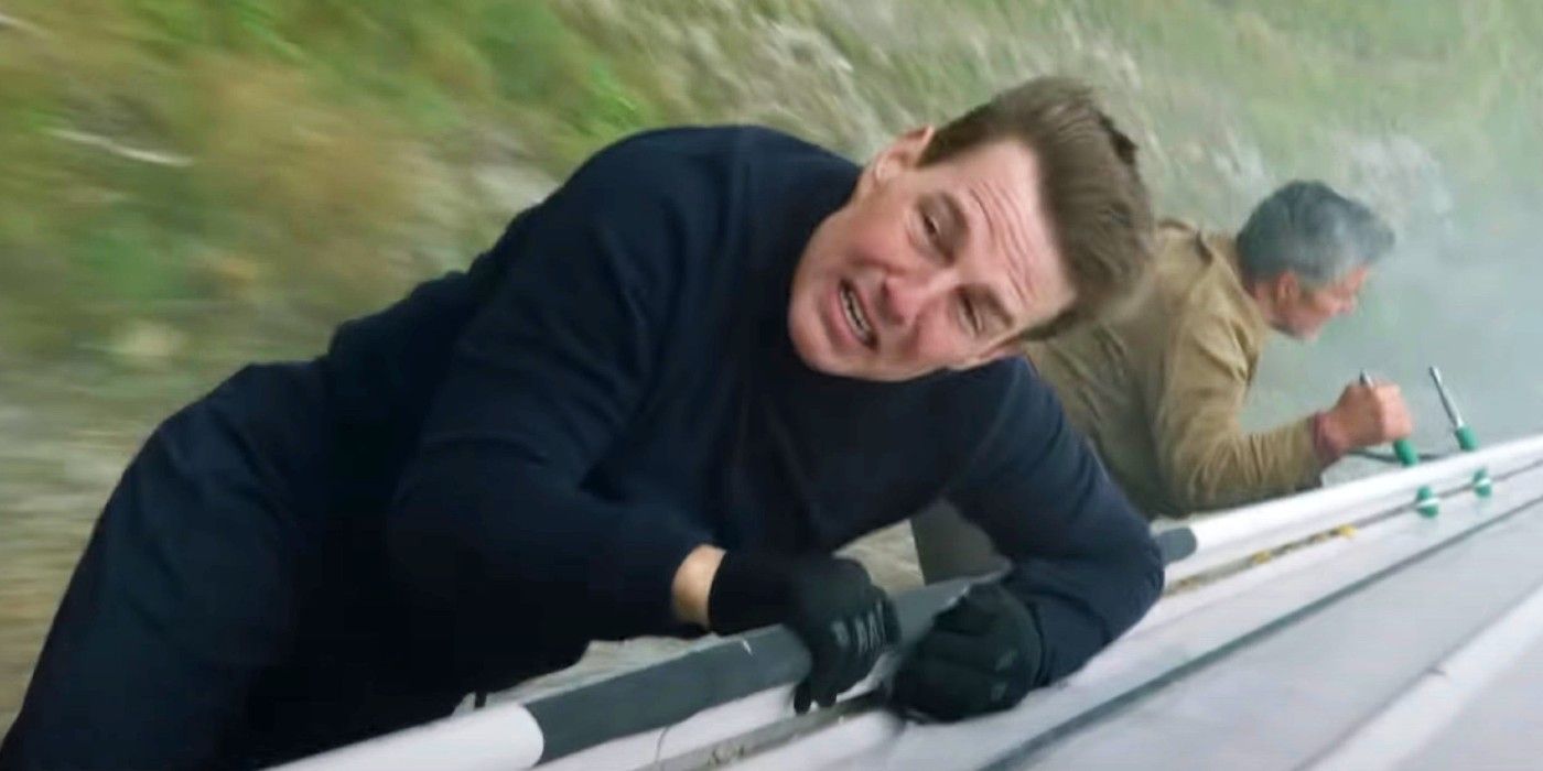 Tom Cruise hanging off the side of a train in Mission Impossible Dead Reckoning Part One