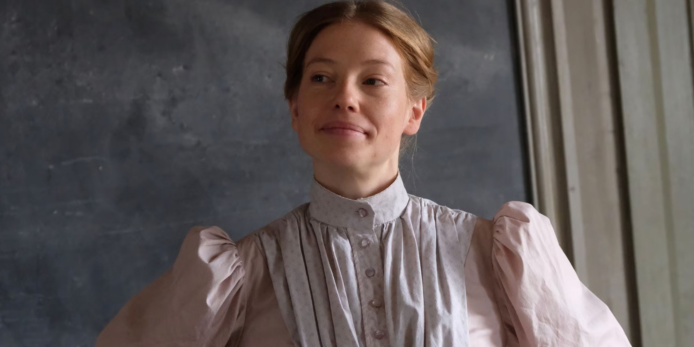 Ms. Stacy in front of her blackboard in Anne With An E
