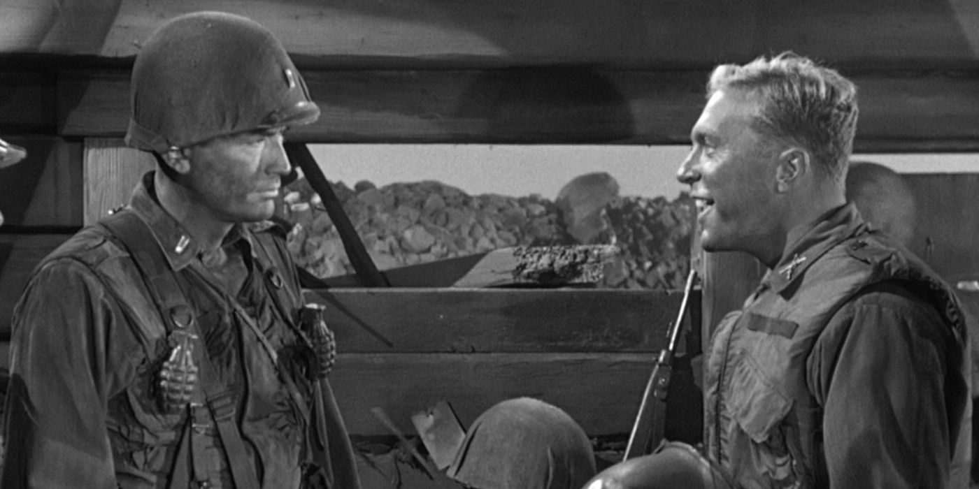 Gregory Peck looking angrily at a smiling soldier in Pork Chop Hill.