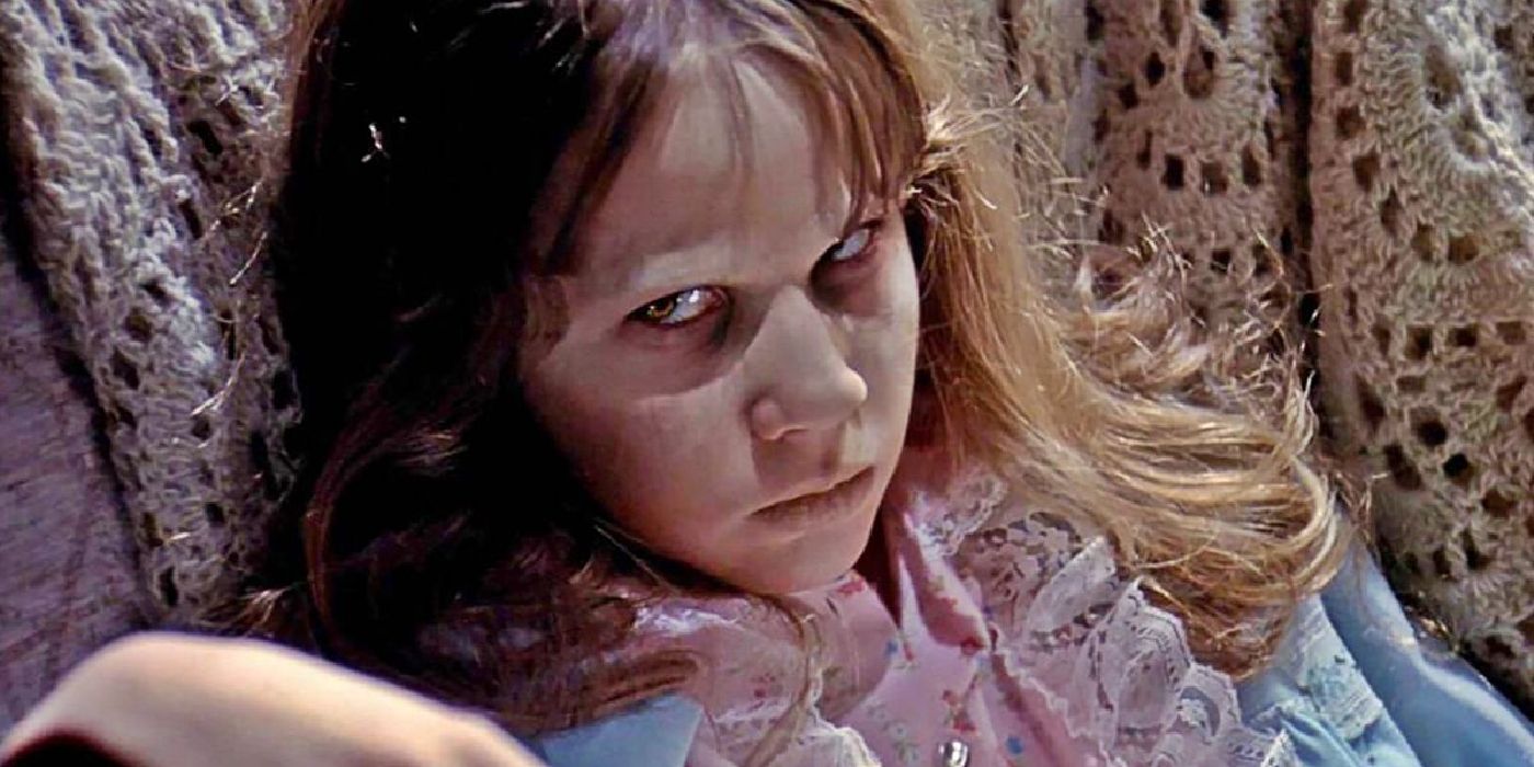 A possessed Regan MacNeil glares at the camera in The Exorcist.