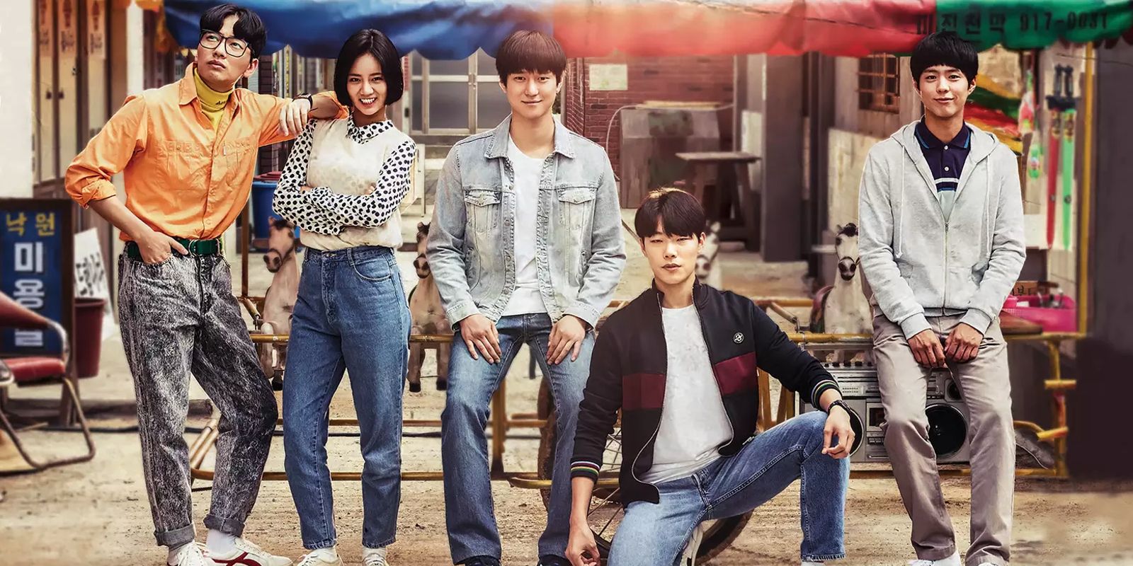 The characters of Reply 1988 poses for a photograph.