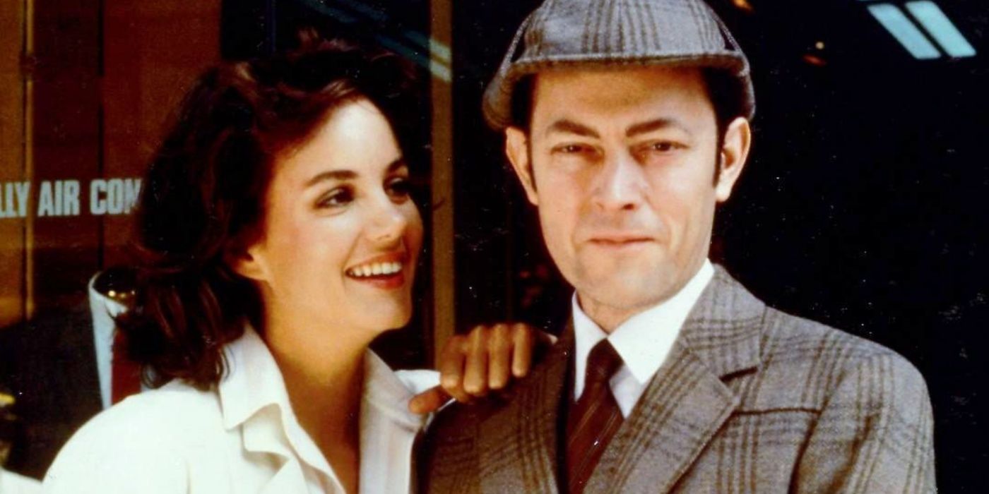 A woman smiling next to Sherlock in the Return Of Sherlock Holmes TV movie adaptation