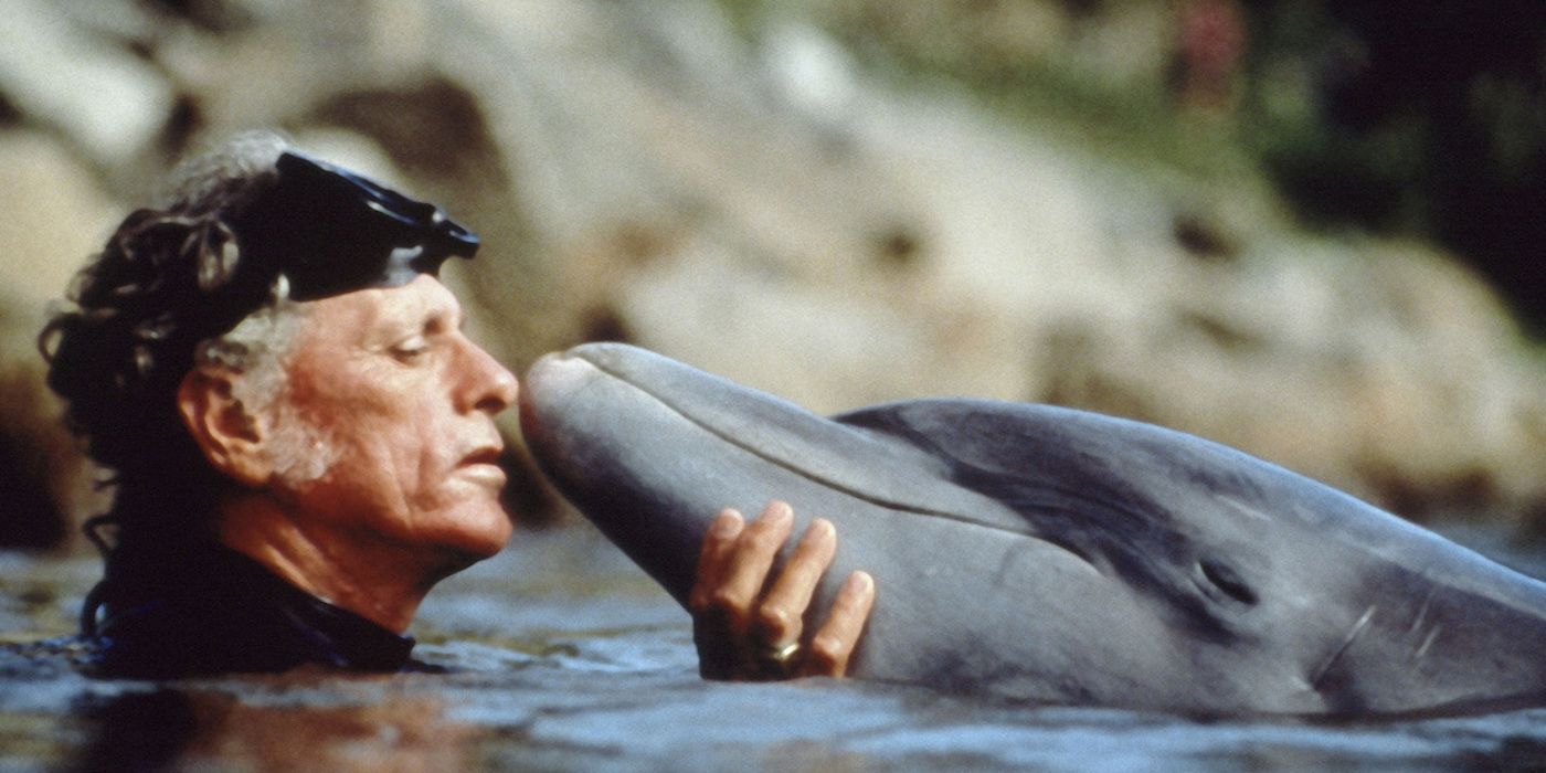 Ric O'Barry in the water with a dolphin in The Cove