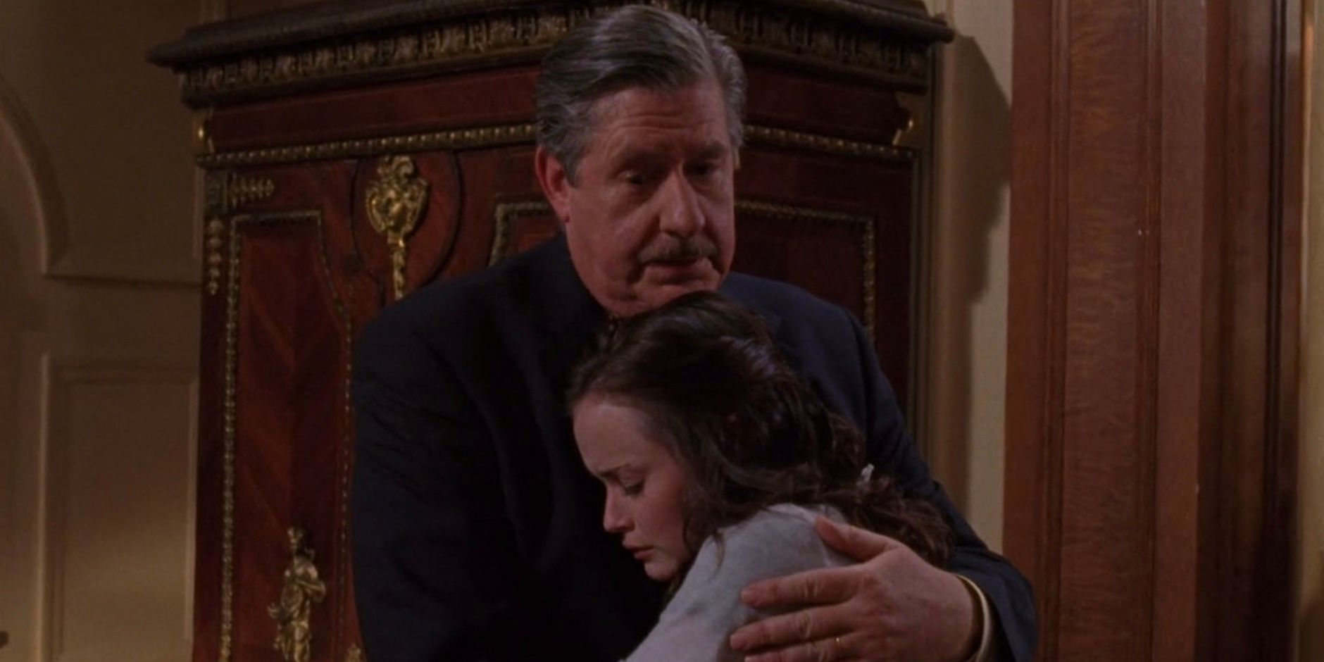 Richard hugs Rory in Gilmore Girls