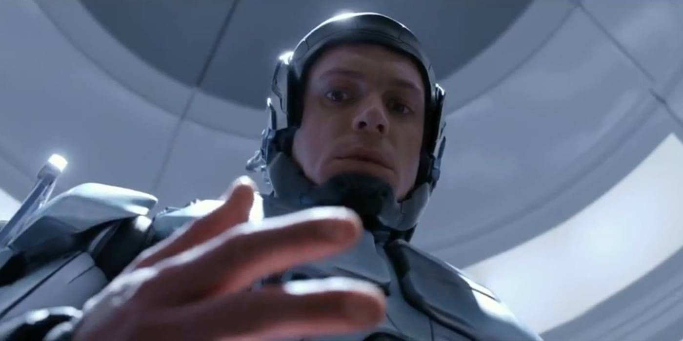 Joel Kinnaman looks at his hand in RoboCop