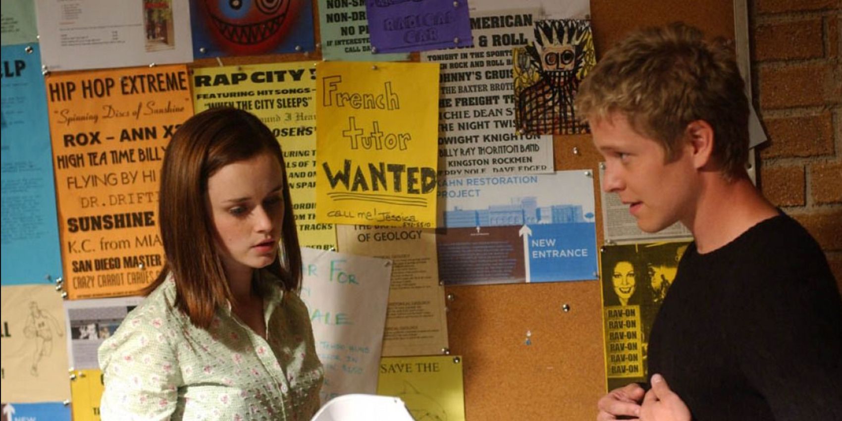 Rory and Logan meet for the first time in front of a bulletin board in Gilmore Girls