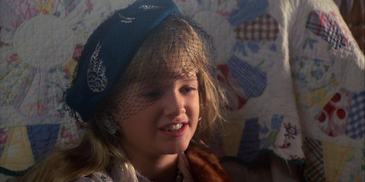 Sarah smiling and looking sideways in Children of the Corn
