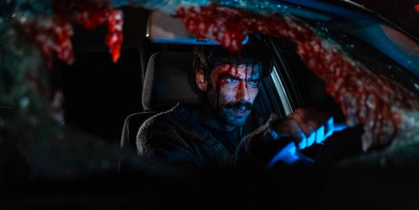 A man driving in a blood-covered car in When Evil Lurks