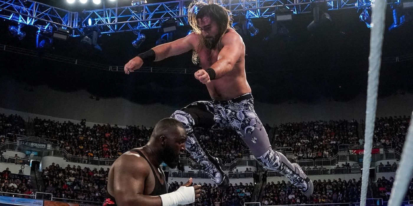 Seth Rollins performing a stomp on Omos at Backlash 2023.