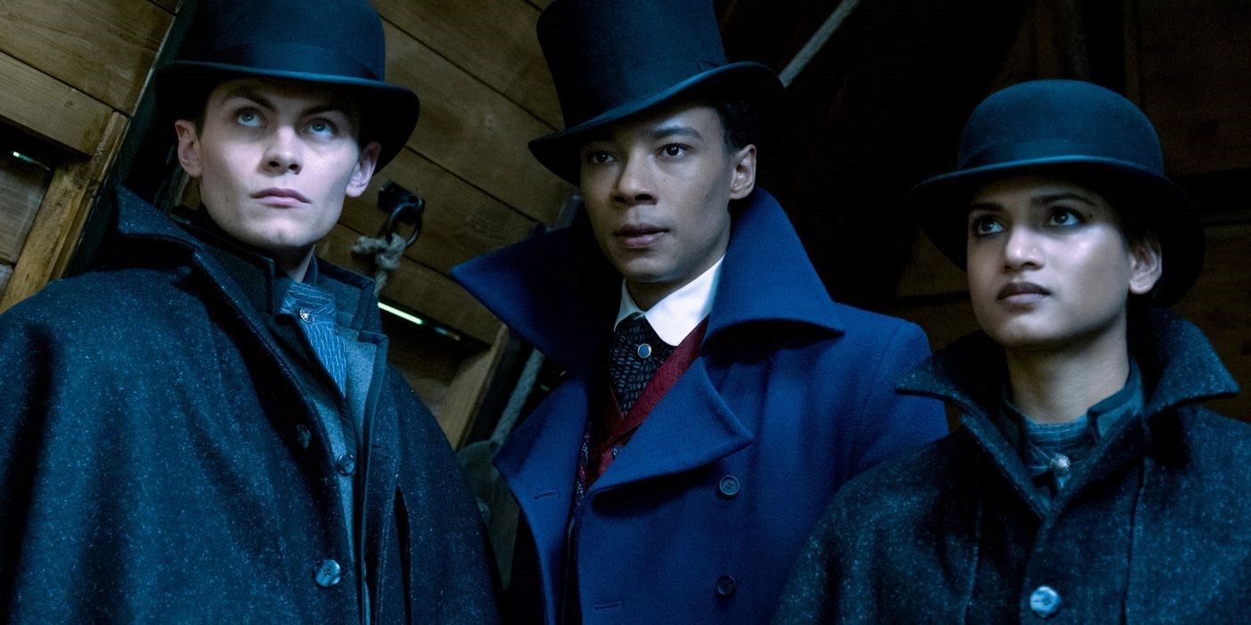 Freddy Carter, Kit Young, and Amita Suman as Kaz, Jesper, and Inej wearing coats and hats in Shadow and Bone season 2