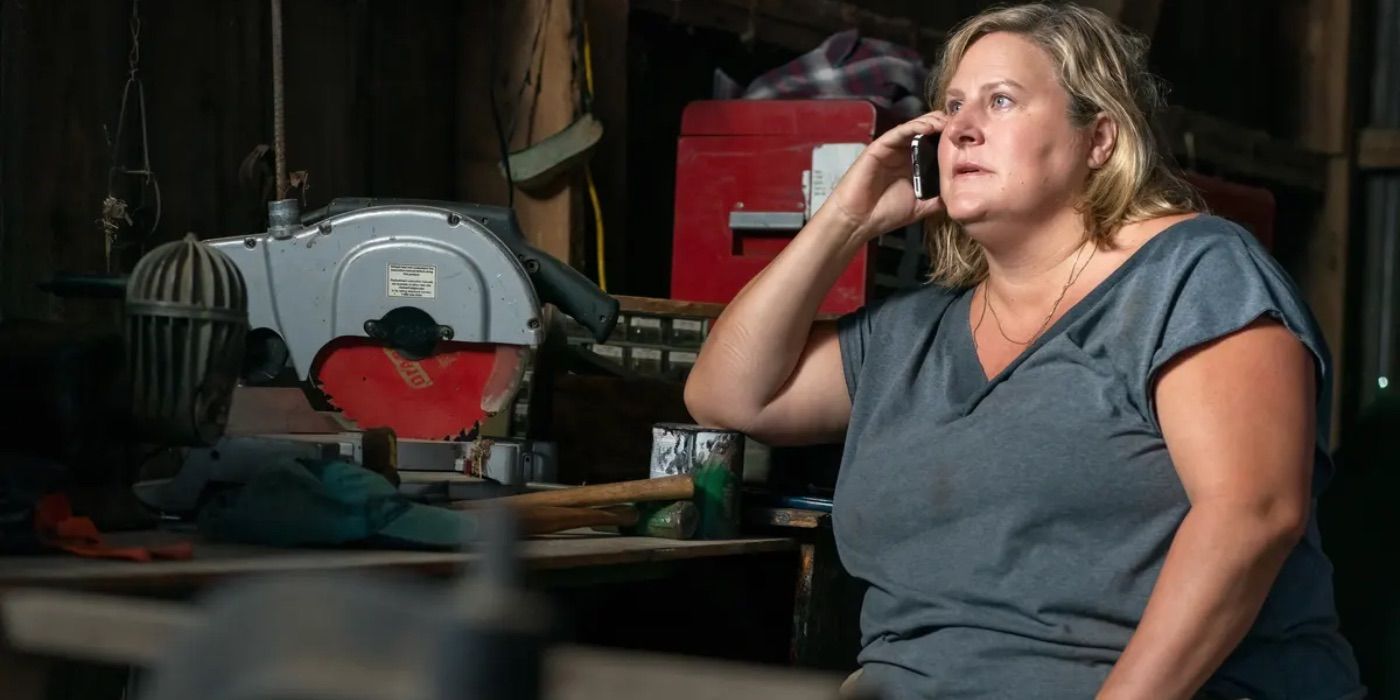 Bridget talks on the phone in Somebody Somewhere