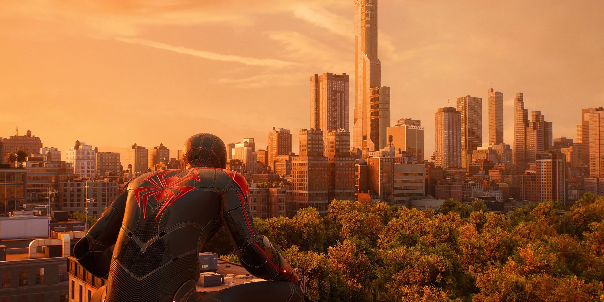 Miles in Spider-Man 2, crouched on a roof and overlooking a portion of Central Park and the skyscrapers of Manhattan behind it.