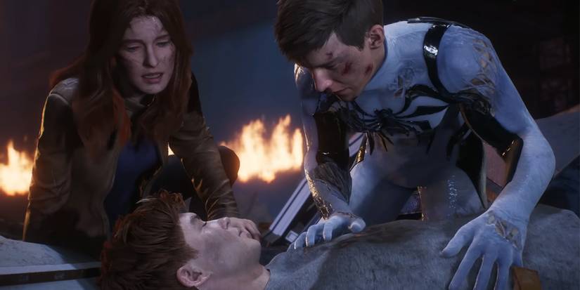 Peter and MJ crouch over a dying Harry Osborn in Marvel's Spider-Man 2