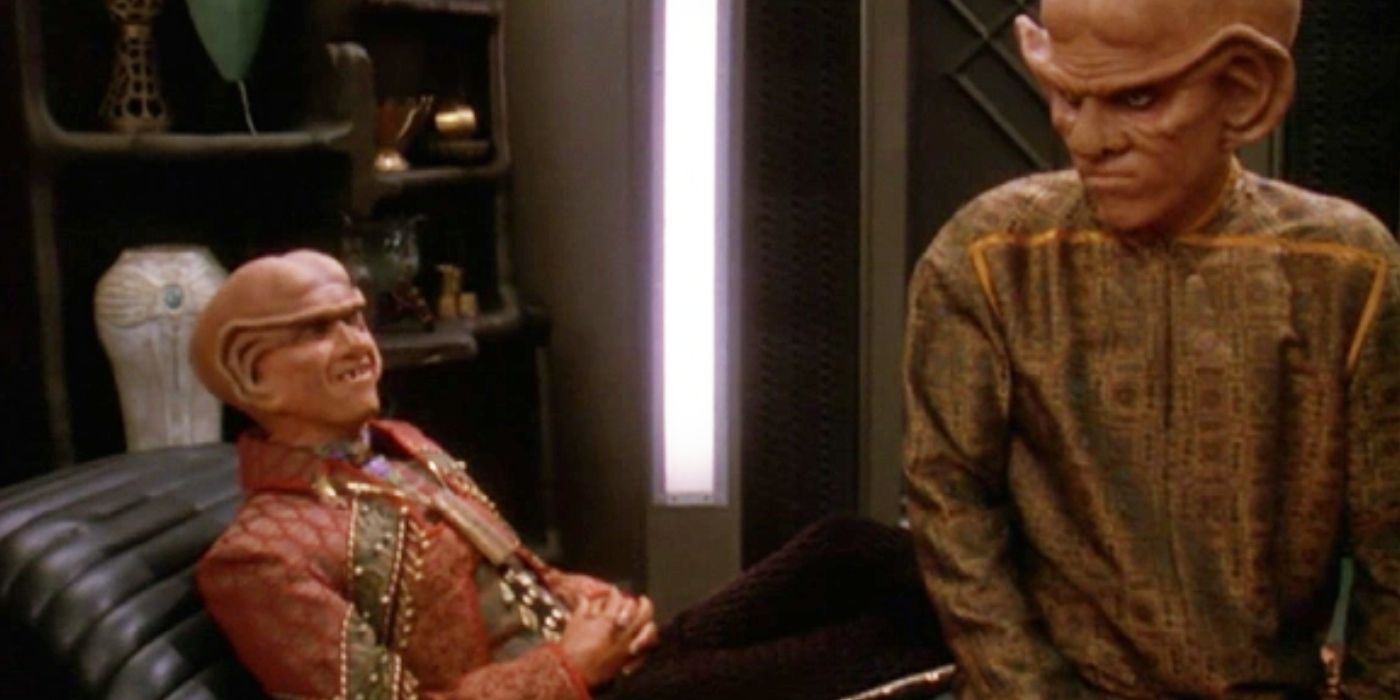 Brunt reclines on a sofa, taunting Quark