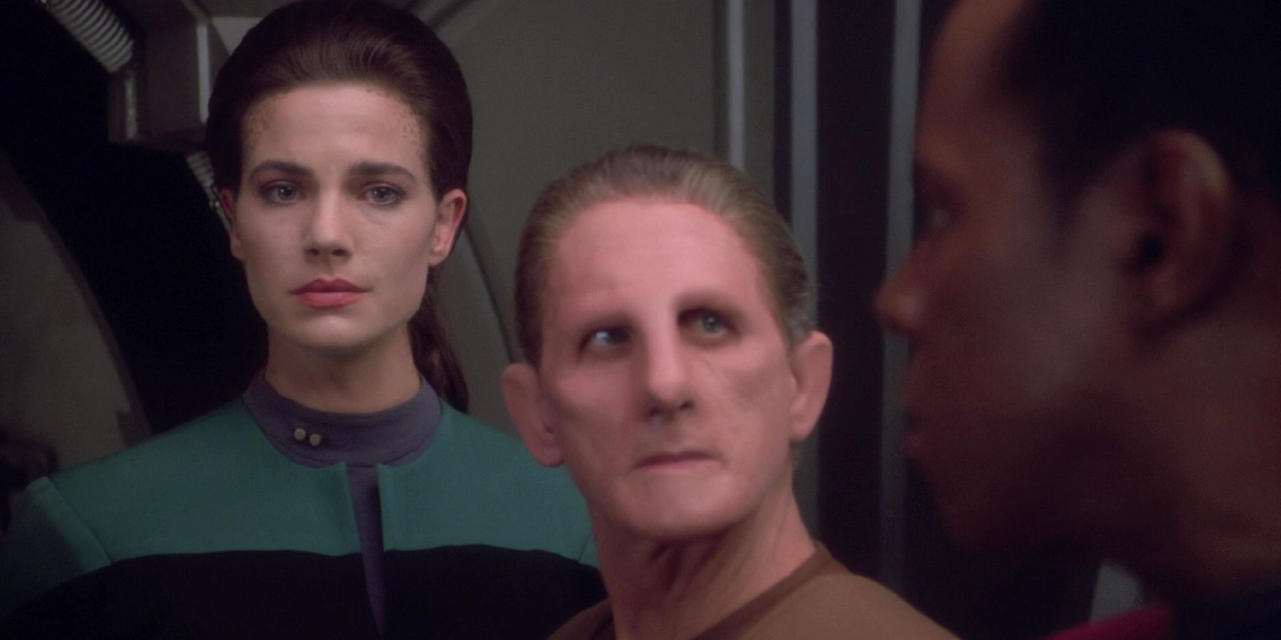 Dax looks upset while Odo and Sisko are concerned