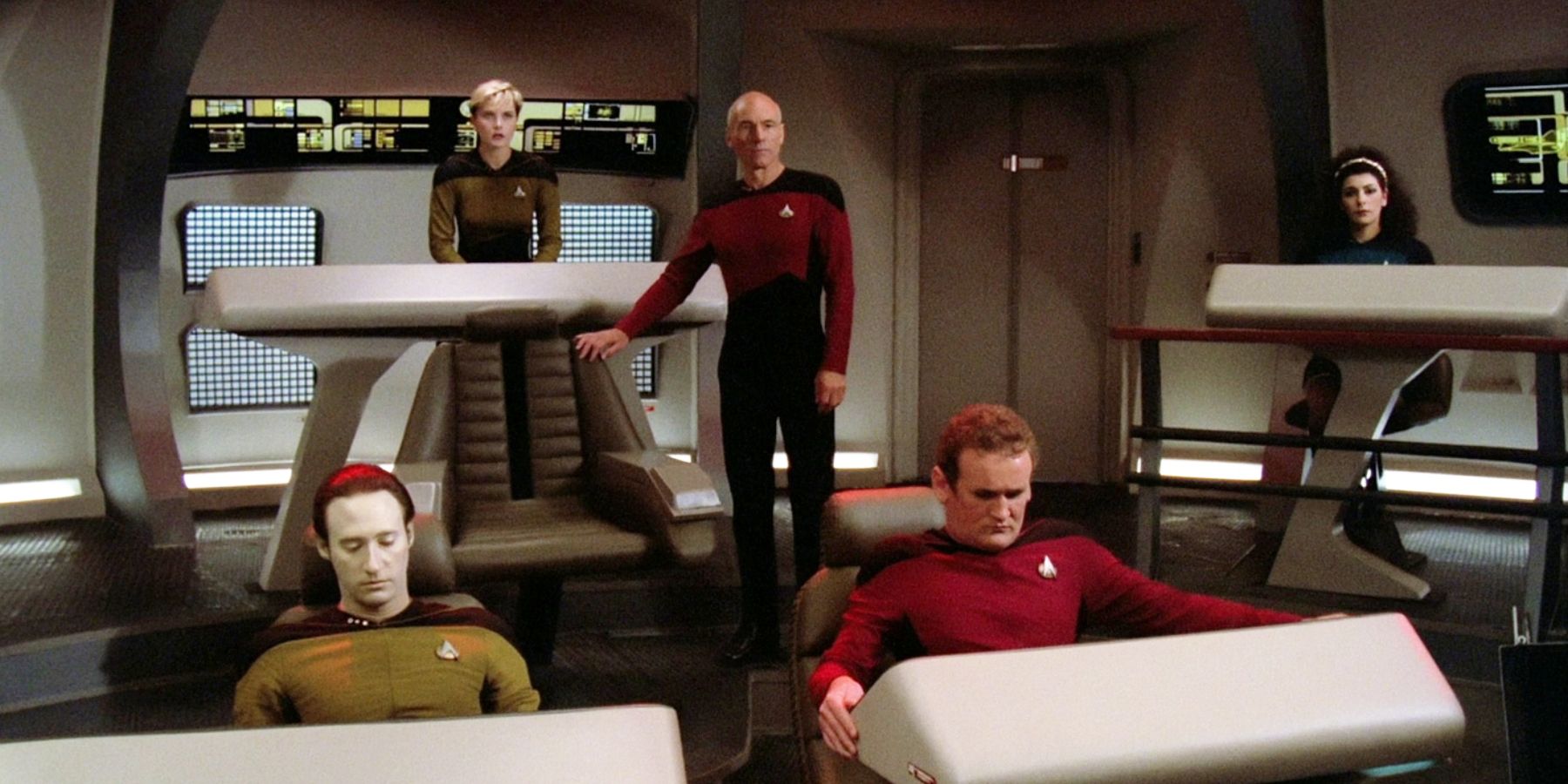 Picard commands his crew from the battle bridge, while standing by his chair