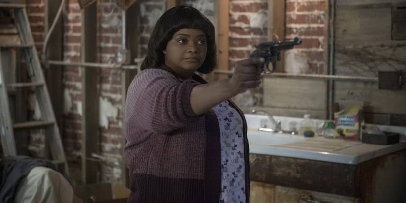 Sue Ann pointing a gun in Ma.