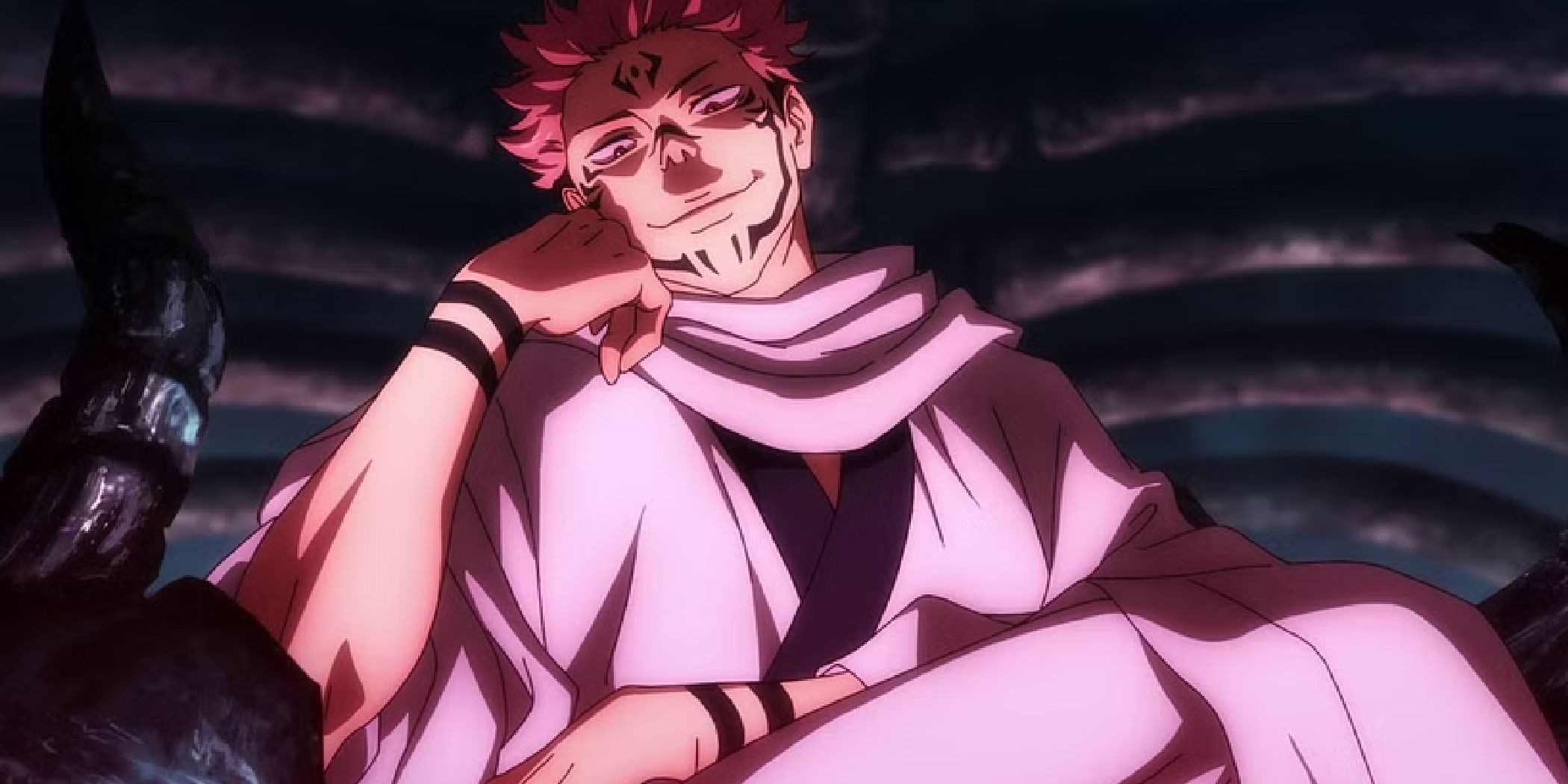 Sukuna from Jujutsu Kaisen sitting on his thrown with a hand on his cheek.